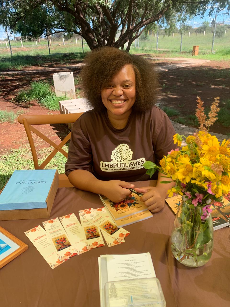 Lesego Mercia Binang signing books at the Frontal Lobe book launch